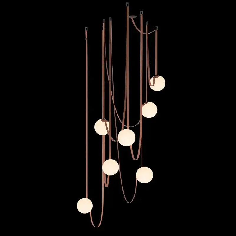 A modern wabi sabi designer living room chandelier with copper tone and seven frosted glass spherical bulbs