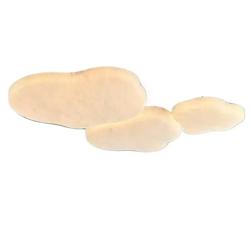 Three irregular pale beige wooden coasters complementing the wabi-sabi decorbites french cream silk ceiling light
