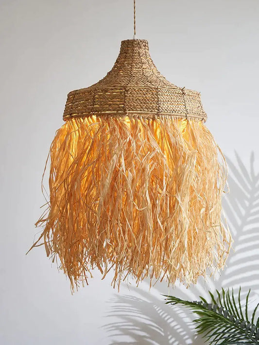 Wabi sabi fringed handmade woven rattan pendant lamp in golden brown with tasseled lower section for dining room decorbites
