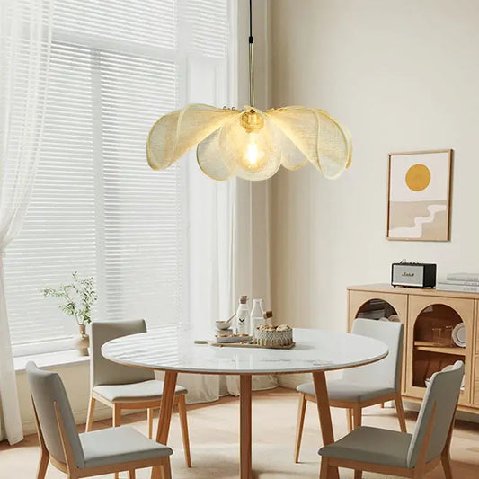 Wabi-sabi golden yellow fabric flower pendant light with a warm glowing led bulb for bedroom lighting