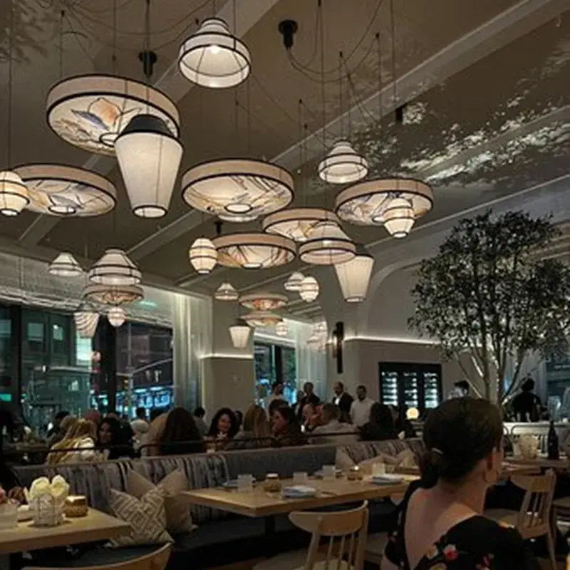 Delicate circular wabi sabi pendant lamp with soft white fabric shades and floral patterns for dining room decorbites colored wabi