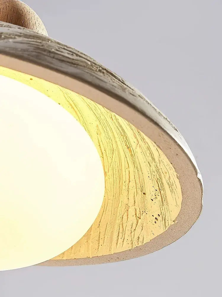 Rustic distressed off-white cement pendant chandelier with wood grain texture and warm yellow glow for dining room decorbites cement pendant