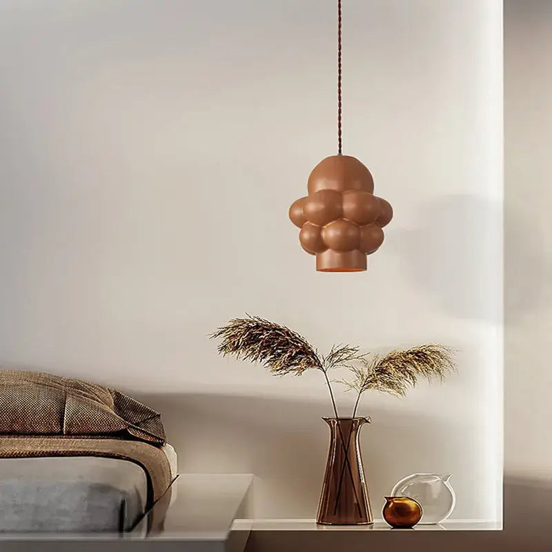 A modern terracotta ceramic pendant light with a bubble design for dining rooms in decorbites creamy wind led chandelier style