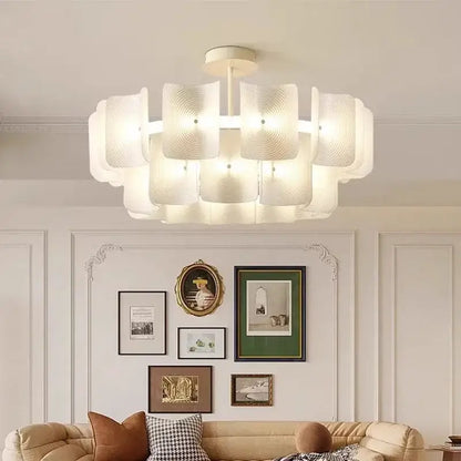 Modern white pendant light with layered petal-shaped glass shades and painted iron finish for dining room