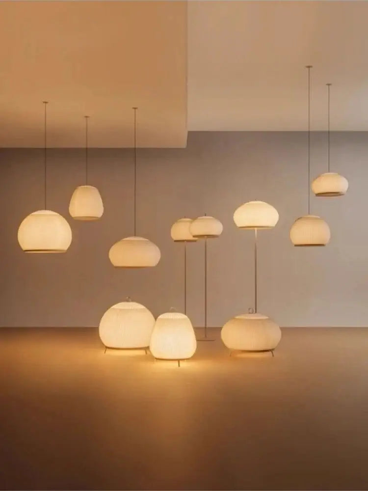 A decorbites light luxury chandelier featuring warm glowing ribbed fabric spheres with minimalist metal fixtures for bedroom decor