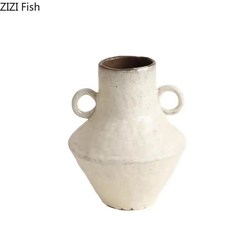 White ceramic decorbites ceramic vase with two circular handles and textured surface for rustic living room decor