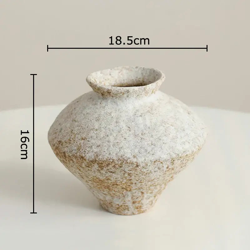 A rustic brown decorbites ceramic vase with a speckled rounded body and narrow neck for living room decor