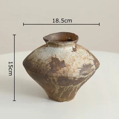 A wabi-sabi rustic brown decorbites ceramic vase with mottled glaze and uneven rim for living room decor