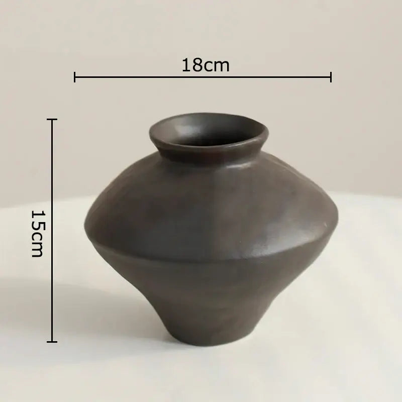 Matte black decorbites ceramic vase with rounded bulbous body and narrow neck for wabi-sabi rustic living room decor