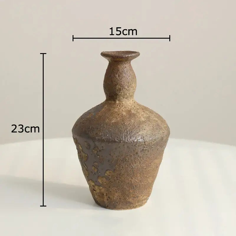 A wabi sabi rustic brown decorbites ceramic vase with textured earthy surface and subtle golden speckles for living room decor