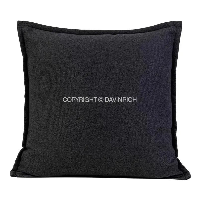 Black textured throw pillow case with subtle heathered finish and stitched edges for living room decor