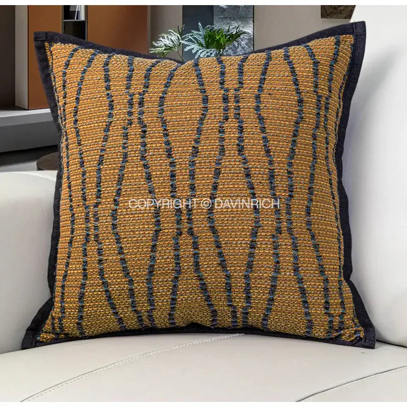 Wabi sabi tan and dark gray woven throw pillow case featuring textured mustard yellow and navy fabric for living room decor