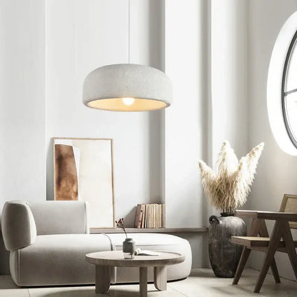Wabi sabi textured off-white ceramic led pendant light with warm circular glow for dining room illumination