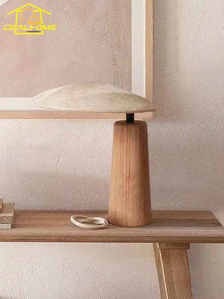 Minimalist wabi-sabi vintage wooden desk lamp with conical base and textured off-white fabric shade for bedroom use