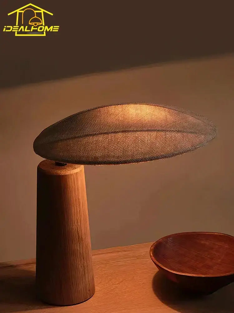Warm-toned vintage wooden desk lamp with a textured fabric shade ideal for bedroom use as a wooden desk lamp