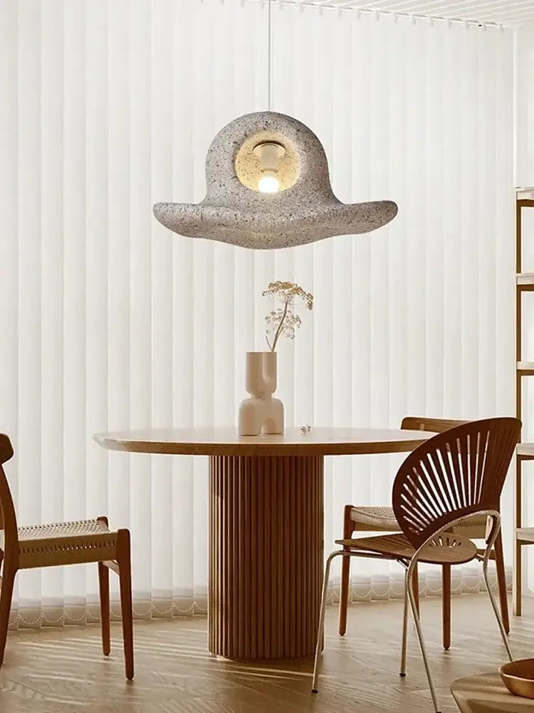 Wabi sabi white cloud island led chandelier pendant light with stone texture and warm glowing bulb by decorbites island led