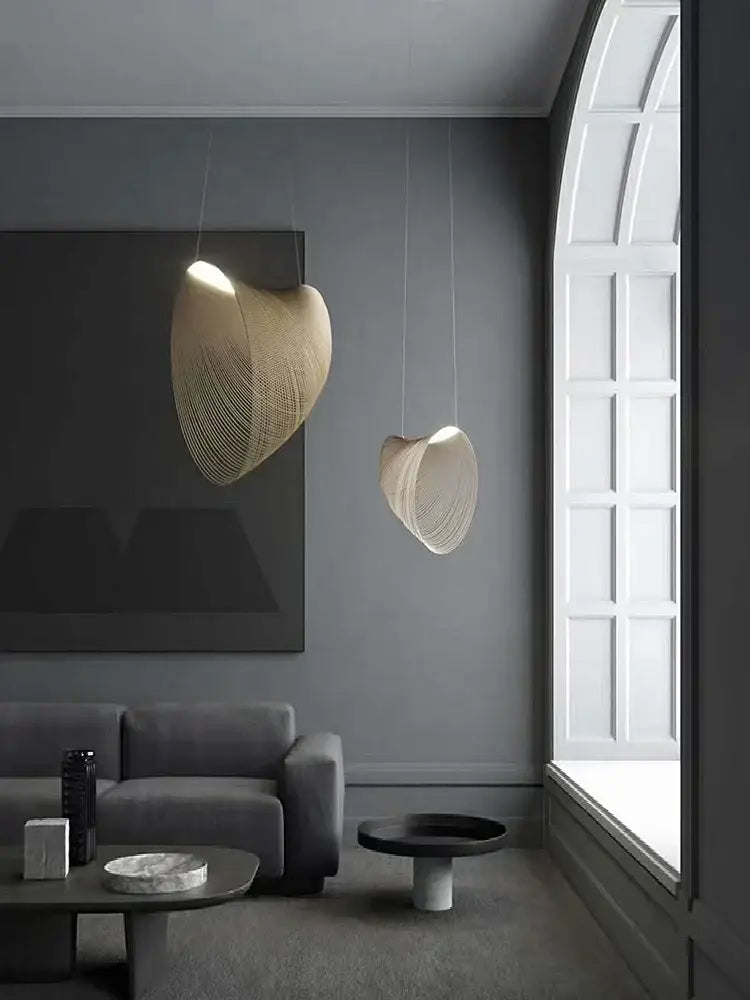 Two elegant beige woven pendant lights with shell design in yellow iron for dining room cord pendant installation