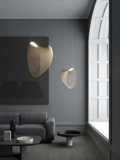 Two elegant beige woven pendant lights with shell design in yellow iron for dining room cord pendant installation