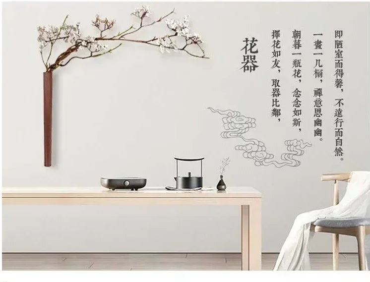A minimalist wooden table with sleek modern design complementing a wall hanging solid wood bohemian vase decoration