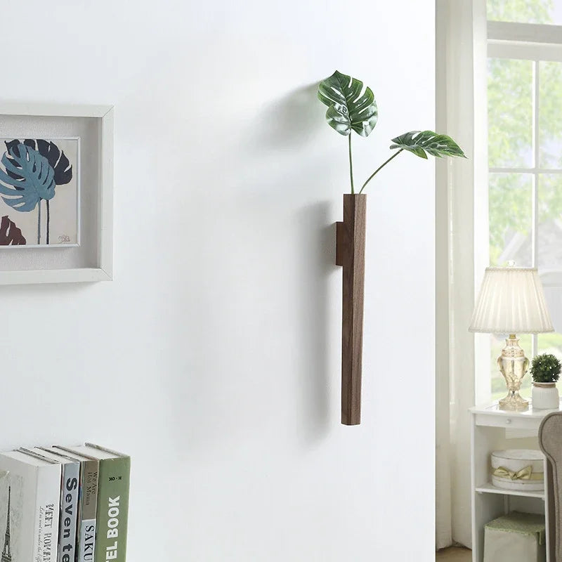 Dark wood wall hanging plant holder with two green monstera leaves for bohemian home wall decoration