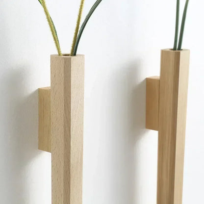 Minimalist light-colored wooden wall hanging vase with sleek rectangular design and subtle wood grain texture for home decor