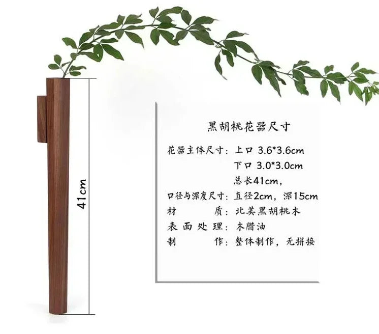 A sleek 41cm tall black walnut wood wall hanging flower vase with smooth oil finish and minimalist design for home decor
