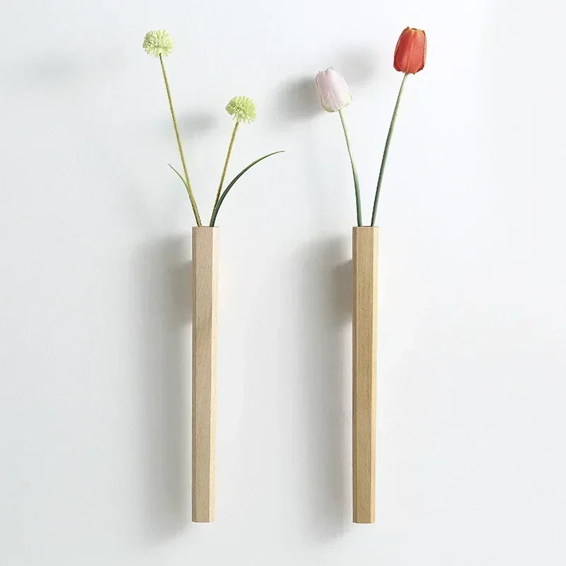 Two minimalist wooden wall hanging vases with green globe flowers and pink and red tulips for bohemian home decor