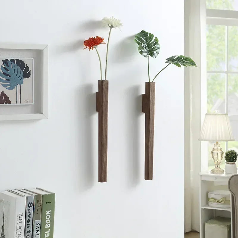 Two sleek dark brown solid wood wall hanging vases with minimalist design for living room or porch decoration