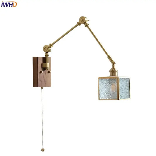 Brass-finished adjustable wall sconce with wooden base and frosted glass panels for decorbites cube glass led lighting