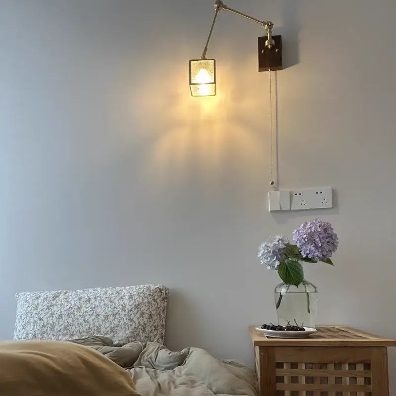 Brass wall sconce with walnut cube glass led shade and adjustable arm for bedroom mirror lighting decorbites cube glass design