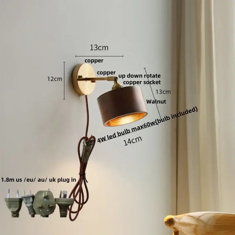 Walnut and brass wall sconce with copper finish cylindrical shade and adjustable rotation featuring pull chain switch