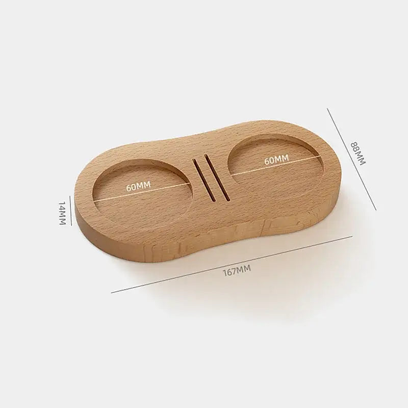 Light brown wooden walnut and oak tamping station with dual compartments and central slit for espresso tamper decorbites espresso