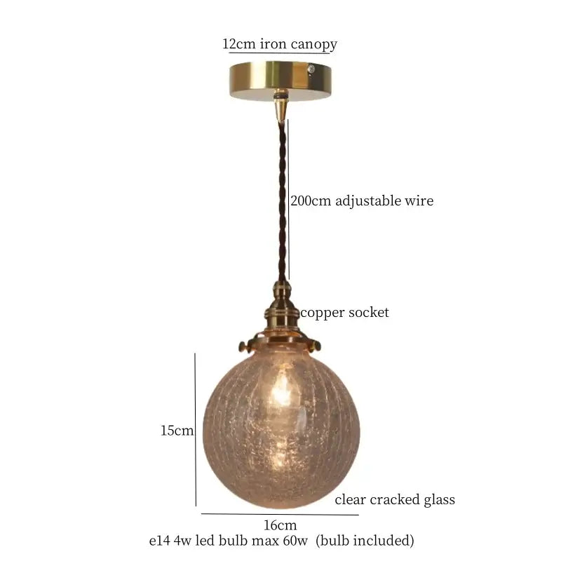 Warm brass pendant light with decorbites cracked glass globe and braided wire suspension for kitchen dining room decor