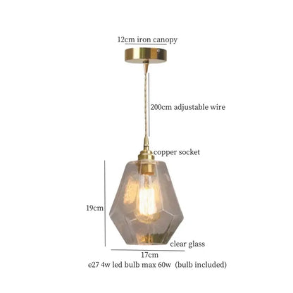 A warm brass cracked glass led pendant light with faceted clear glass shade and copper socket for kitchen decorbites