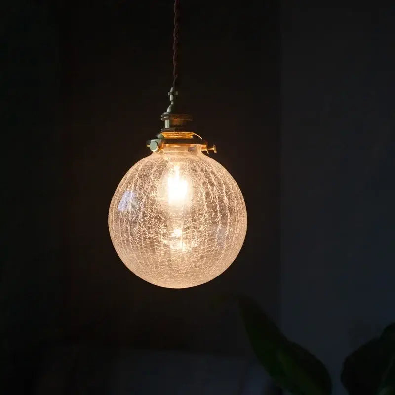 Warm brass cracked glass led pendant light with crackled texture and brass hardware for kitchen dining room decorbites