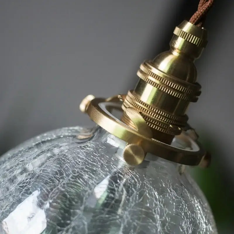Vintage-style warm brass pendant light with decorbites cracked glass led textured globe for kitchen dining room decor