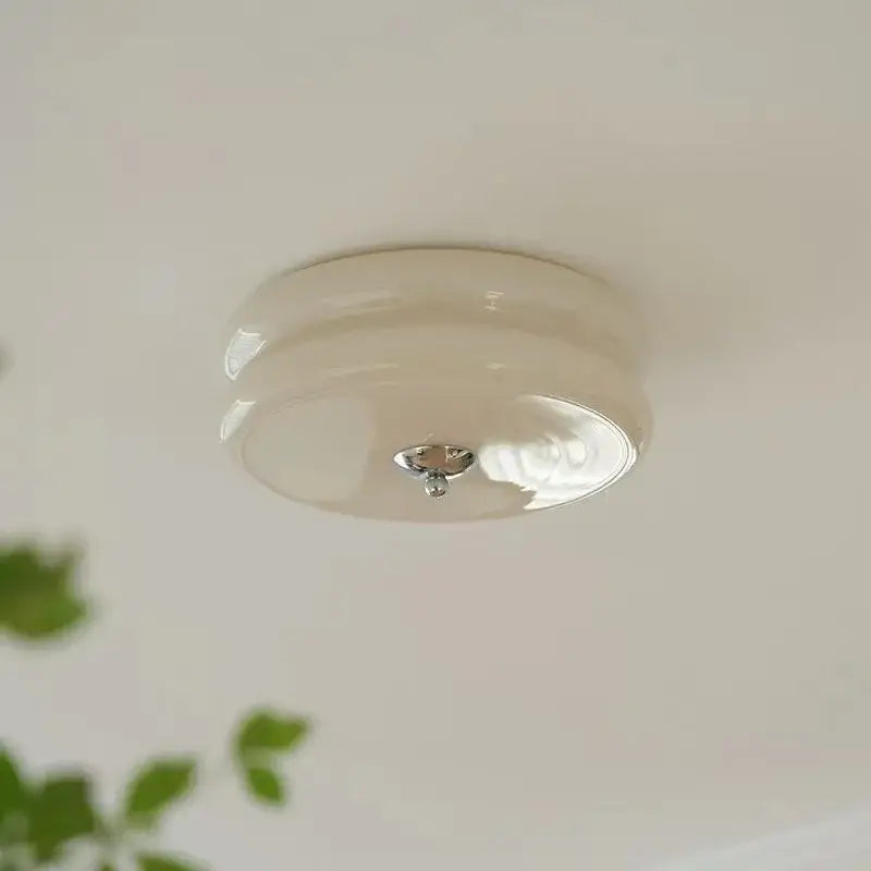 Cream-colored glossy ceramic ceiling light with warm chrome double layer glass led and central metallic fixture
