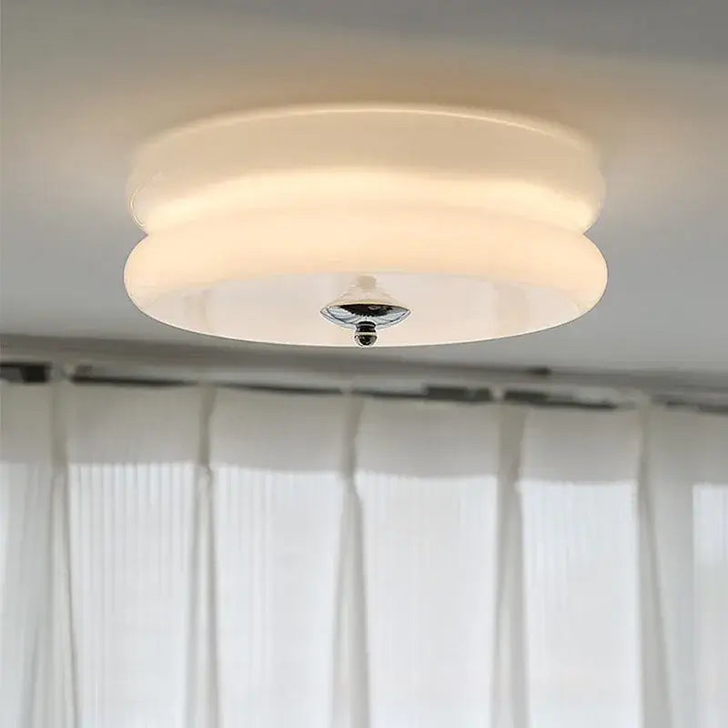 A modern warm chrome double layer glass led ceiling light with frosted white shade for bedroom ceiling lights