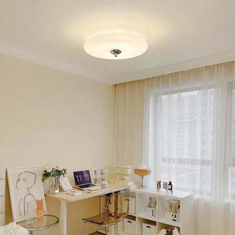 A sleek warm chrome double layer glass led ceiling light with soft white diffuser ideal for bedroom ceiling lights