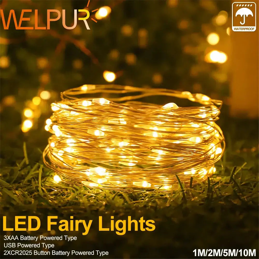Coiled warm gold copper wire fairy lights with glowing bulbs for outdoor garden decor by Decorbites copper wire