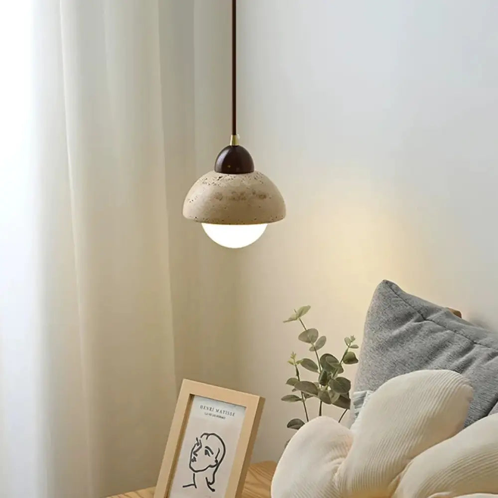 Minimalist warm textured concrete cave stone pendant light with off-white shade and dark brown wooden top for dining room decorbites cave stone pendant