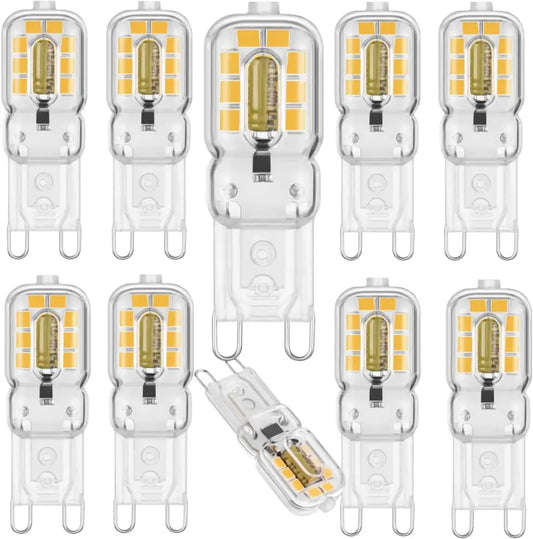 Clear glass DecorBites G9 LED bulb with warm white glow and metallic contacts for living room light decor