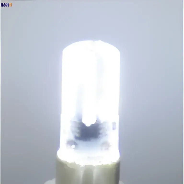 Warm white dimmable decorbites led bulb with clear cylindrical glass and metallic base for living room lighting