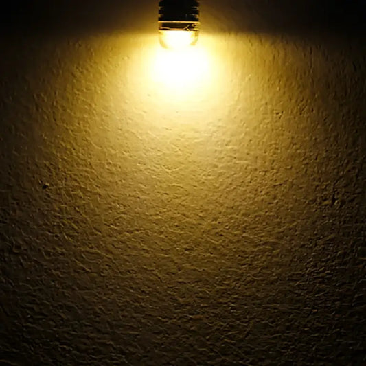 A warm white frosted decorbites g4 led bulb with frosted glass and metallic base for home lighting and bedrooms
