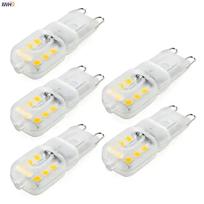 Clear glass warm white g9 led corn lights with yellowish leds and metallic contacts for chandeliers and bedrooms