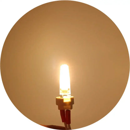 Warm white glass g4 led bulb with compact cylindrical glass body and metallic base for kitchen replacement light decorbites g4 led