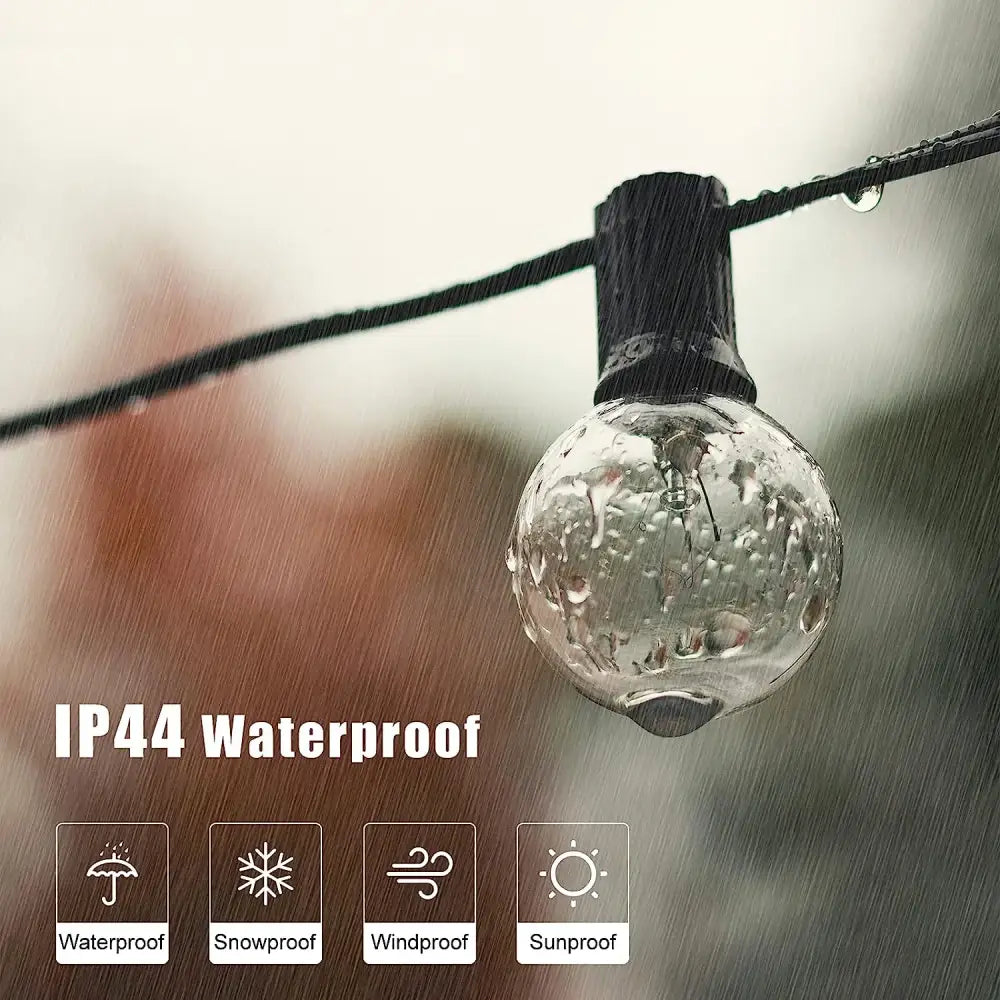 Clear glass g40 tungsten outdoor string light bulb with warm white glow hanging in rain for garden decorbites lighting