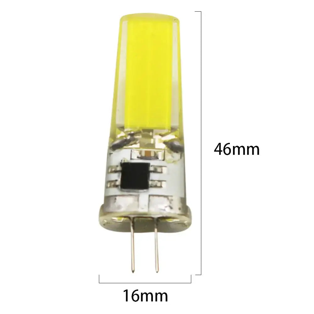 A 46mm yellow-tinted decorbites g4 cob led bulb with clear glass and two metallic pins for living room crystal light decor