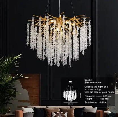 Gold-toned branch-style chandelier with cascading clear crystal droplets featuring warm yellow led glass bulb for bedroom lighting decorbites g9 led