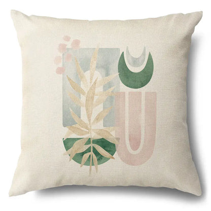Beige linen pillow case with green leaves decorative abstract design and pastel geometric shapes for living room use